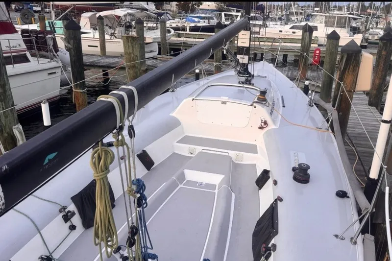 Slide: The Image of 2008 Melges 32 sailboat docked at marina, showcasing deck and rigging. - 8