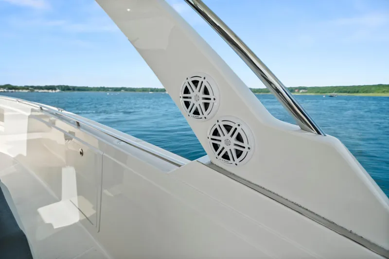 Slide: The Image of 2022 Tiara Yachts 38 LS boat with sleek design and dual speakers on deck. - 35
