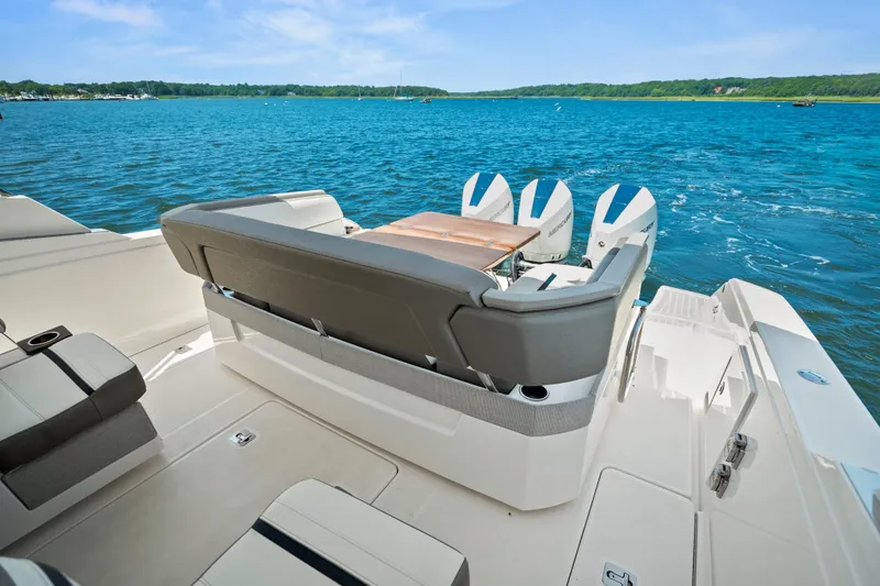 Slide: The Image of 2022 Tiara Yachts 38 LS luxury boat with spacious seating and scenic water view. - 22