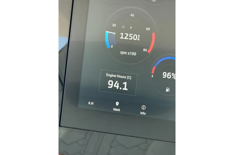 Slide: The Image of Dashboard display of a 2022 Tiara Yachts 38 LS showing 1250 RPM and 94.1 engine hours. - 37