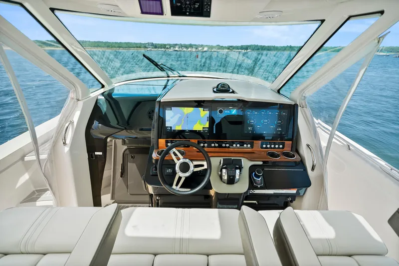 Slide: The Image of 2022 Tiara Yachts 38 LS helm with advanced navigation system and luxurious seating. - 16