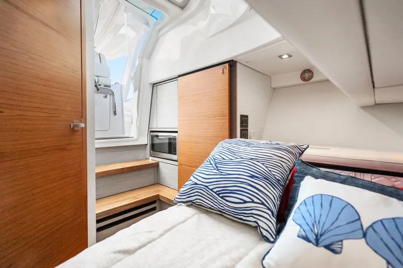 Slide: The Image of Luxurious interior of 2022 Tiara Yachts 38 LS, featuring cozy bedding and modern amenities. - 26