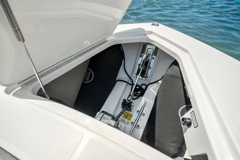 Slide: The Image of Open storage compartment on 2022 Tiara Yachts 38 LS, showcasing interior details and mechanisms. - 34