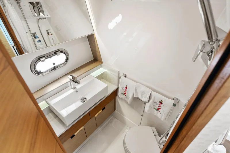 Slide: The Image of Luxurious bathroom in 2022 Tiara Yachts 38 LS, featuring modern sink and elegant fixtures. - 29