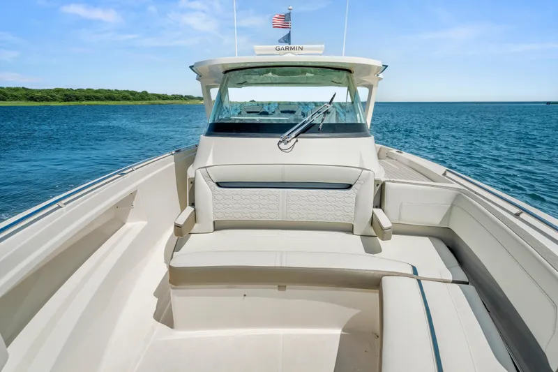 Slide: The Image of 2022 Tiara Yachts 38 LS boat with luxurious seating on open water. - 32