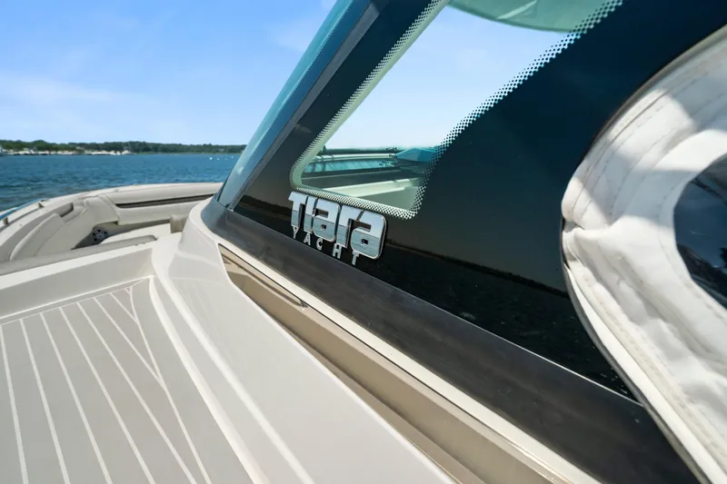 Slide: The Image of 2022 Tiara Yachts 38 LS on water, showcasing sleek design and luxury features. - 33