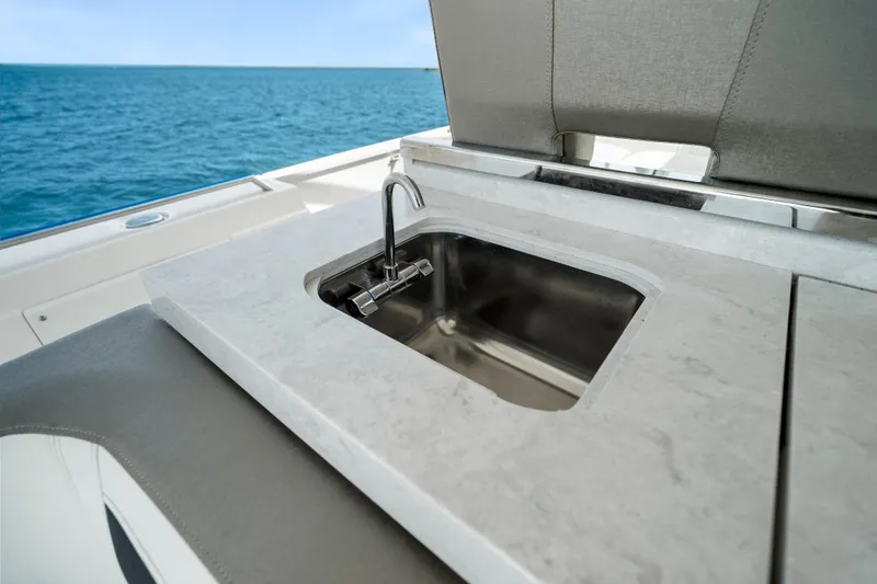 Slide: The Image of Luxury sink on 2022 Tiara Yachts 38 LS, overlooking ocean. - 24