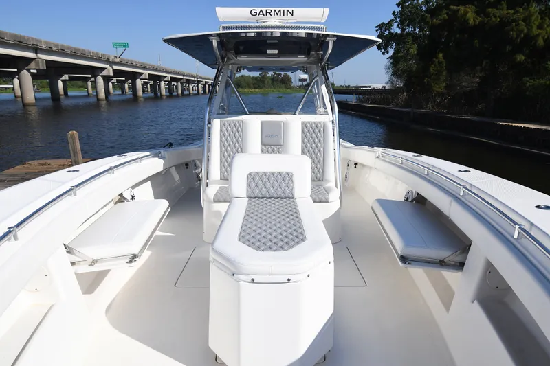 Slide: The Image of 2014 Invincible 42 Open Fisherman boat with spacious seating and sleek design. - 14
