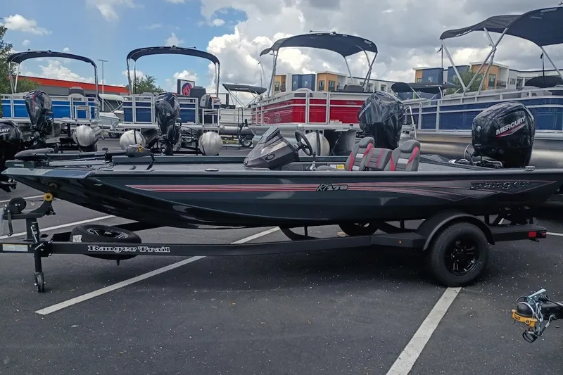 Slide: The Image of 2027 Ranger RT178 boat with Mercury engine on trailer in parking lot. - 1