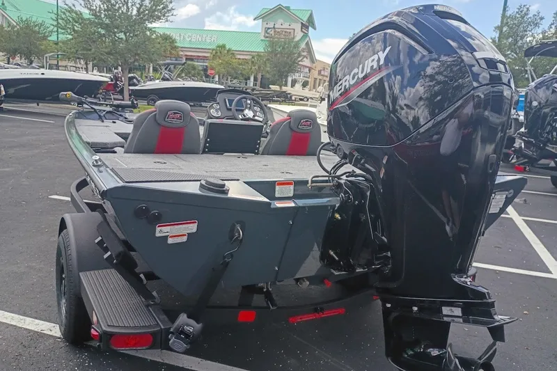 Slide: The Image of 2027 Ranger RT178 boat with Mercury engine in a parking lot. - 2