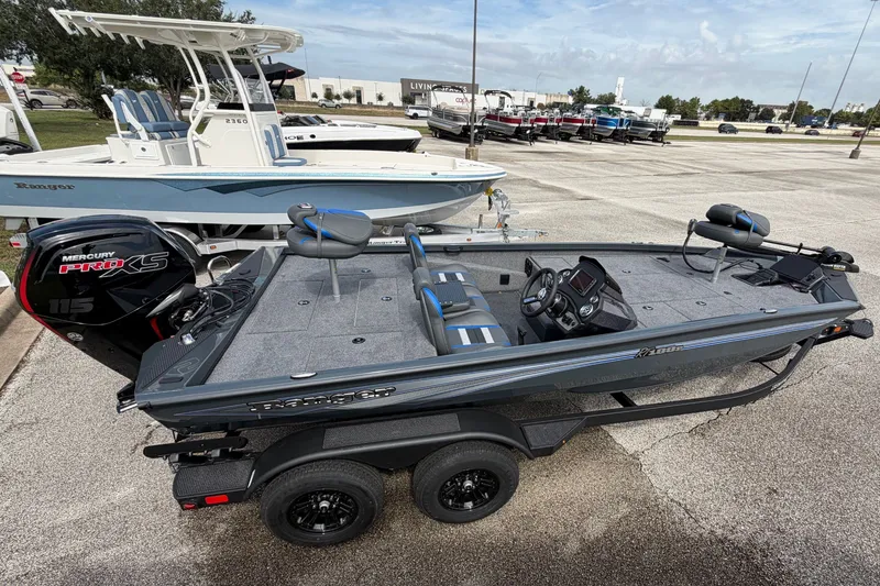 Slide: The Image of 2027 Ranger RT188P fishing boat with Mercury Pro XS engine in a parking lot. - 7