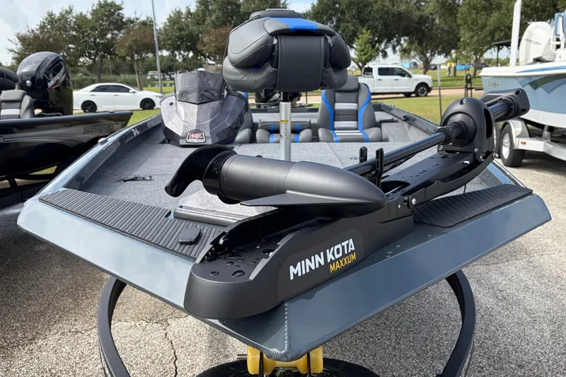 Slide: The Image of 2027 Ranger RT188P boat with Minn Kota Maxxum trolling motor, parked outdoors. - 1