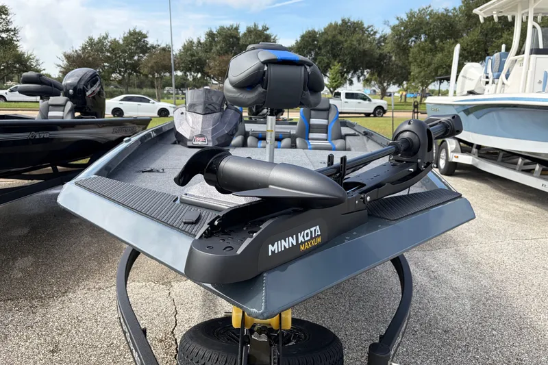 Slide: The Image of 2027 Ranger RT188P boat with Minn Kota Maxxum trolling motor, parked outdoors. - 106