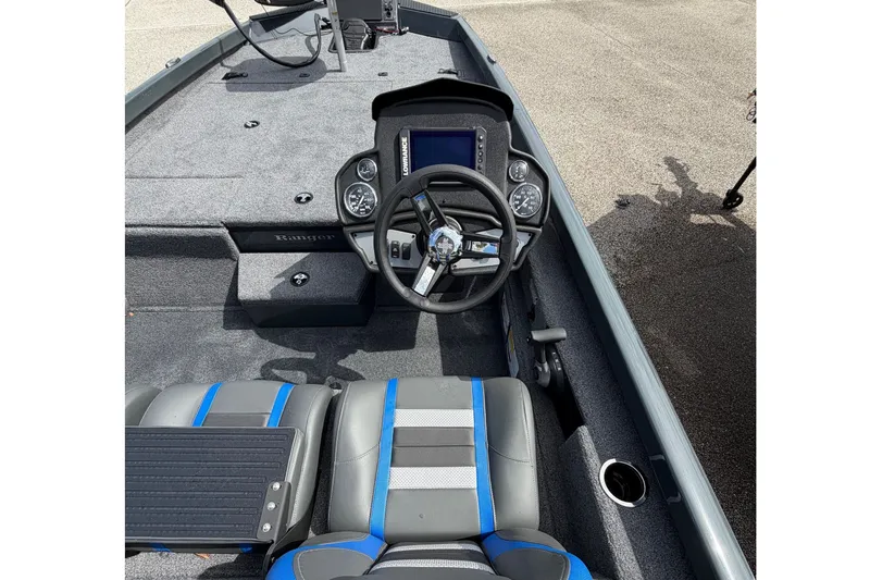 Slide: The Image of 2027 Ranger RT188P boat interior with steering wheel and seating, featuring modern design. - 15