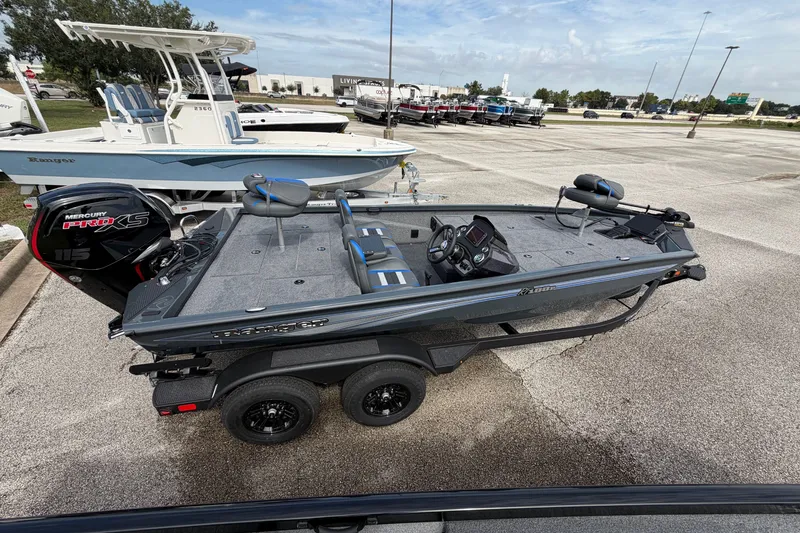 Slide: The Image of 2027 Ranger RT188P fishing boat with Mercury Pro XS engine in a parking lot. - 113