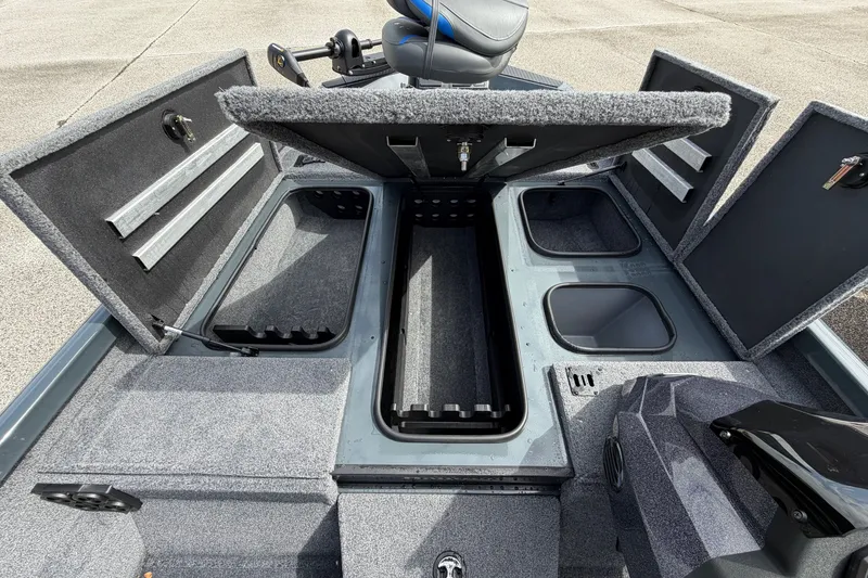 Slide: The Image of 2027 Ranger RT188P boat interior with open storage compartments and seating. - 116