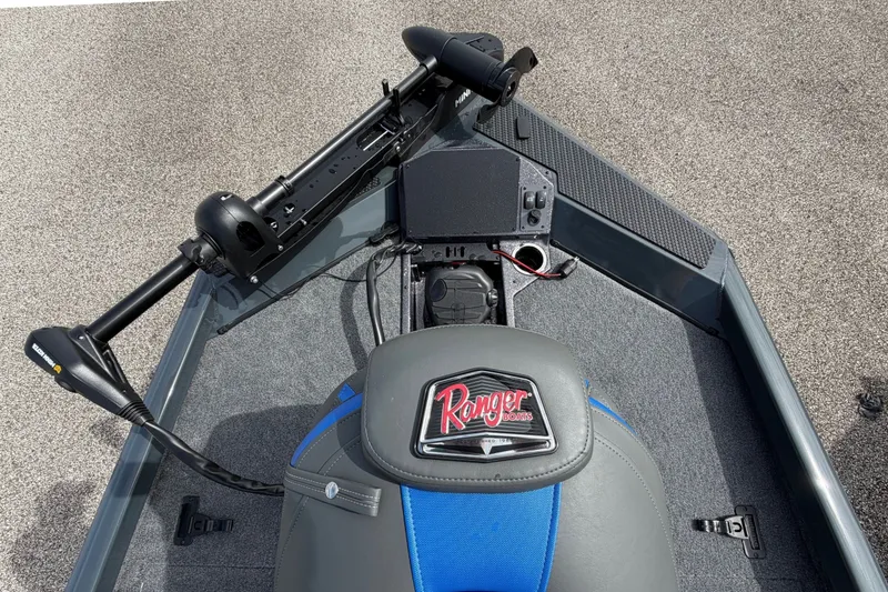 Slide: The Image of 2027 Ranger RT188P boat interior with blue and gray seating and control panel. - 11