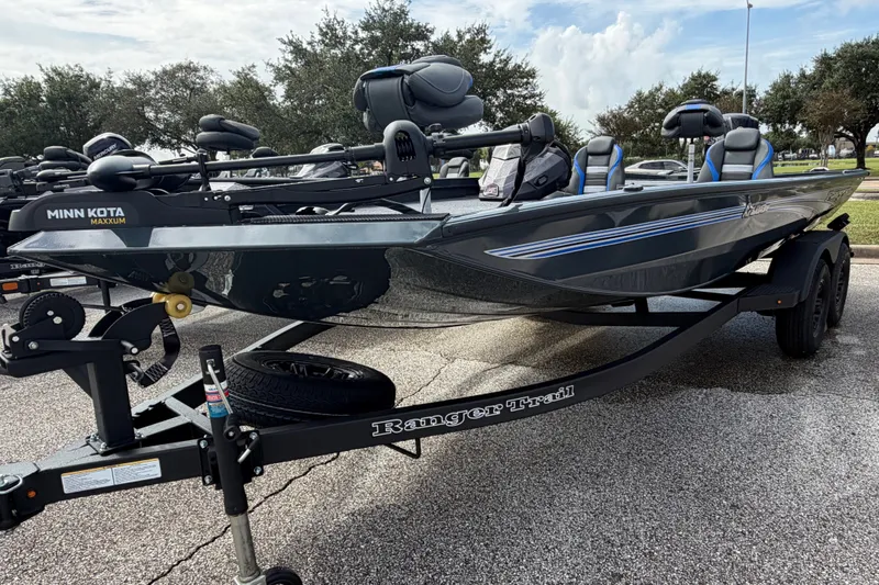Slide: The Image of 2027 Ranger RT188P fishing boat on trailer, featuring Minn Kota Maxxum trolling motor. - 2