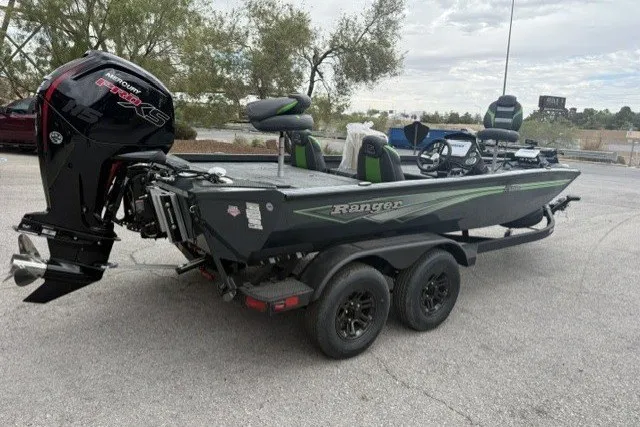 Slide: The Image of 2027 Ranger RT188P boat with powerful outboard motor on a trailer, parked outdoors. - 1