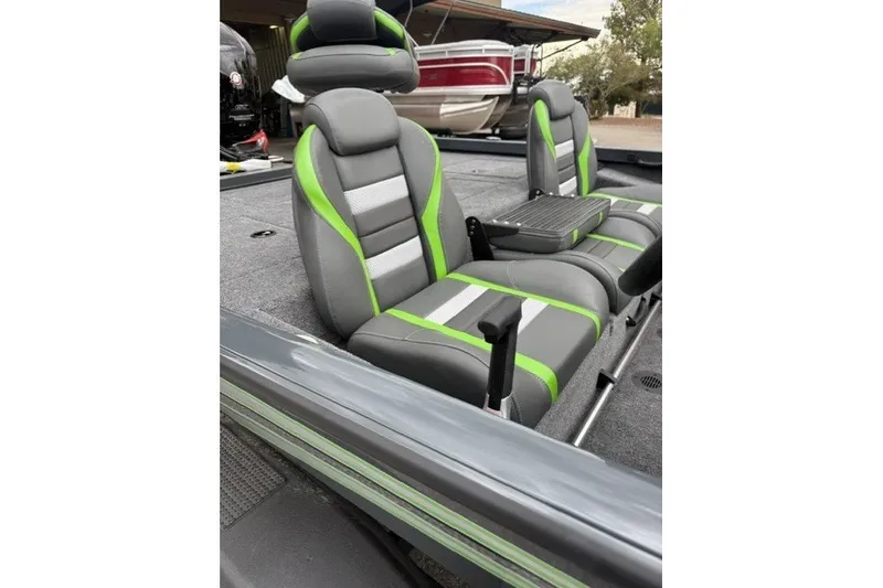 Slide: The Image of 2027 Ranger RT188P boat interior with gray and green seats. - 9