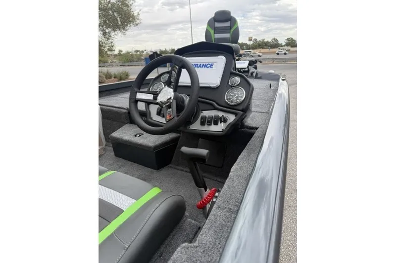 Slide: The Image of 2027 Ranger RT188P boat cockpit with steering wheel, gauges, and seating. - 7