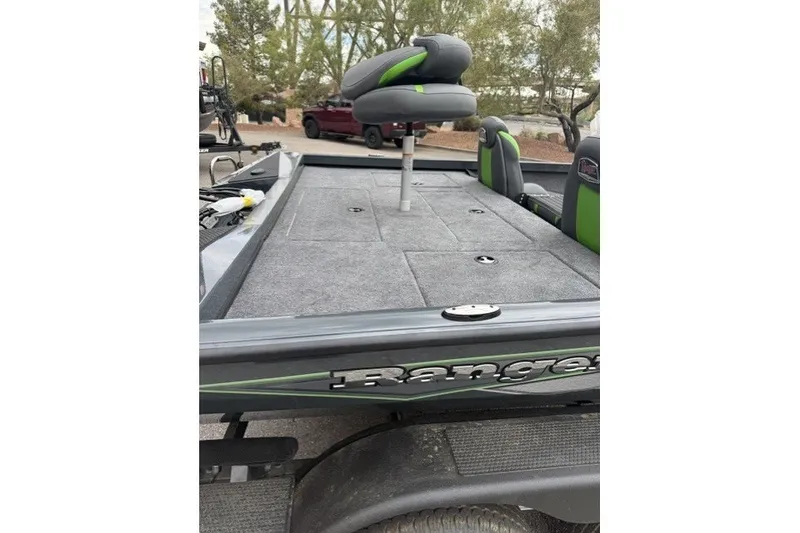 Slide: The Image of 2027 Ranger RT188P boat interior with green-accented seats and carpeted deck. - 10