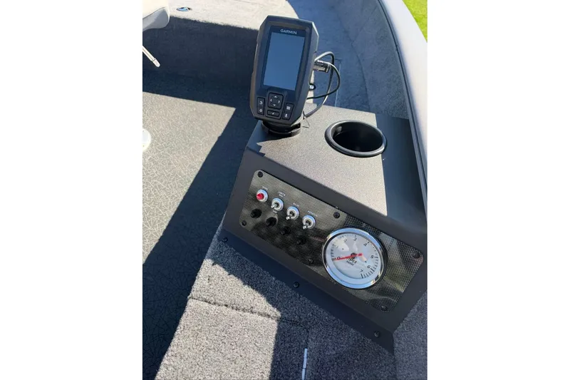 Slide: The Image of 2027 Tracker Super Guide V-16 T dashboard with Garmin device and gauges. - 13