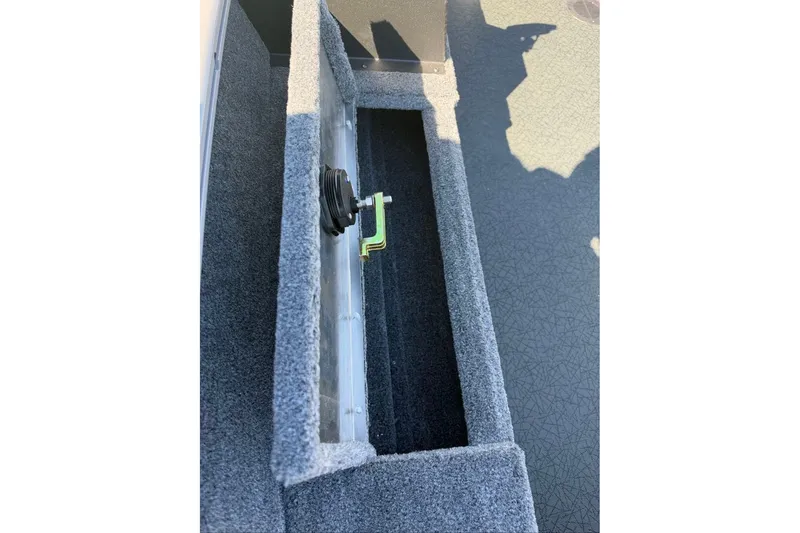 Slide: The Image of Interior view of 2027 Tracker Super Guide V-16 T boat compartment with carpeted finish. - 14