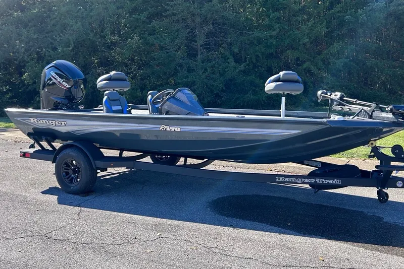 Slide: The Image of 2027 Ranger RT178 fishing boat on trailer, parked outdoors. - 2