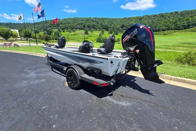 Slide: The Image of 2027 Ranger RT188 boat with powerful outboard motor on a trailer, parked outdoors. - 3