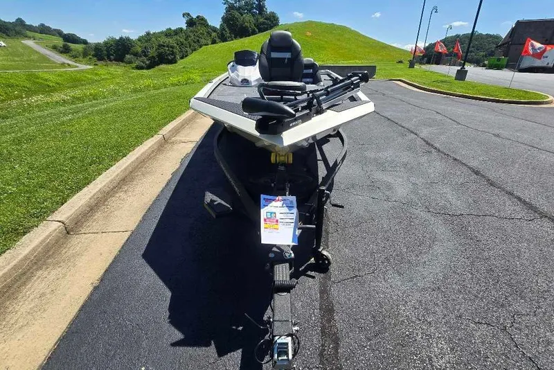 Slide: The Image of 2027 Ranger RT188 boat on trailer in sunny outdoor setting. - 6