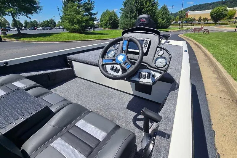 Slide: The Image of 2027 Ranger RT188 boat interior with steering wheel and dashboard controls. - 8
