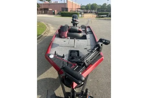 Slide: The Image of 2027 Ranger RT178 fishing boat with red exterior, parked outdoors. - 4