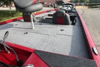 Slide: The Image of 2027 Ranger RT178 boat interior with red and gray seating, steering console, and storage compartments. - 7