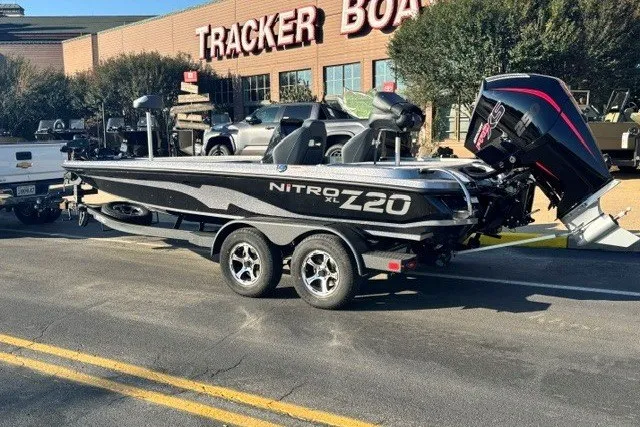 Slide: The Image of 2027 Nitro Z20 XL Pro boat on trailer outside Tracker Boats store. - 4