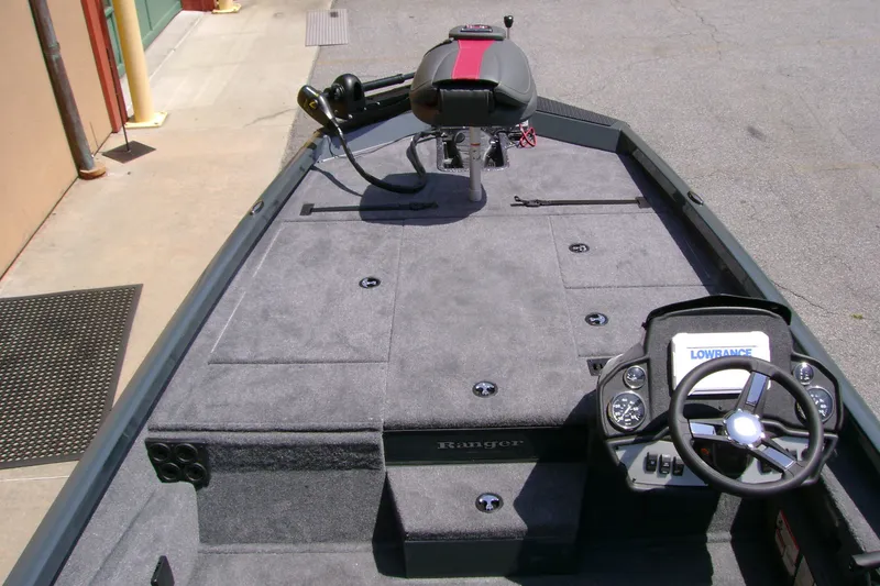 Slide: The Image of 2027 Ranger RT188P boat interior with steering wheel and seating. - 7