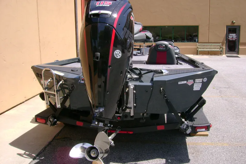 Slide: The Image of 2027 Ranger RT188P boat with powerful outboard motor, parked outdoors. - 5
