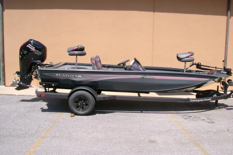 Slide: The Image of 2027 Ranger RT188P fishing boat on trailer, featuring sleek design and powerful outboard motor. - 1