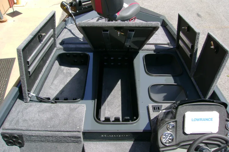 Slide: The Image of 2027 Ranger RT188P boat interior with open storage compartments and Lowrance electronics. - 12