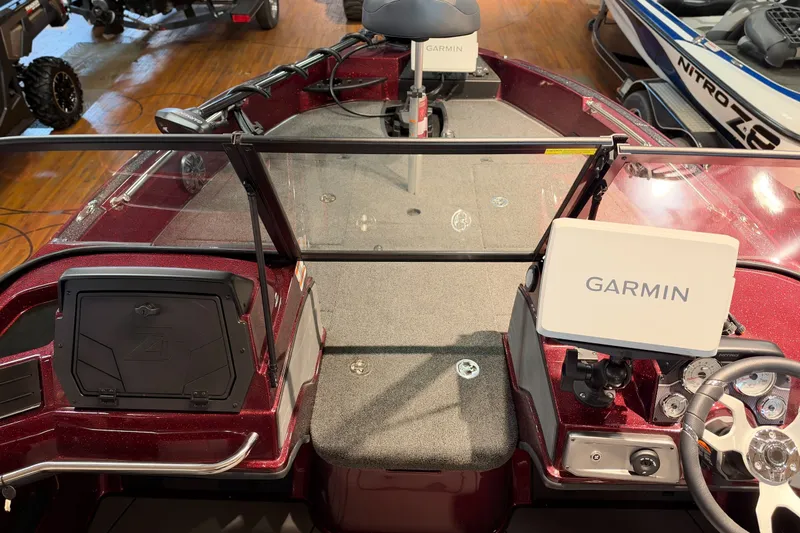 Slide: The Image of 2027 Nitro ZV20 Sport Pro boat interior with Garmin navigation system, red finish, and seating area. - 41