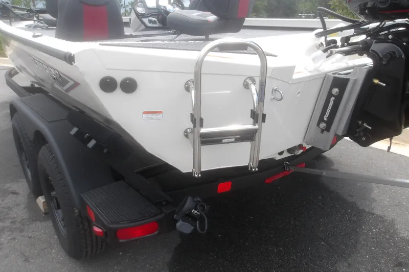 Slide: The Image of 2027 Ranger RT198P boat rear view with ladder and trailer on pavement. - 8