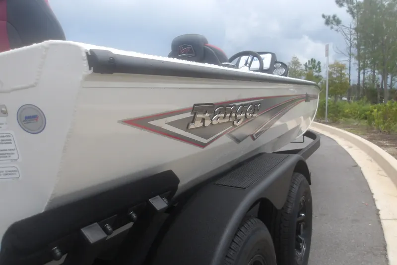 Slide: The Image of 2027 Ranger RT198P boat on trailer, side view with logo and sleek design. - 7