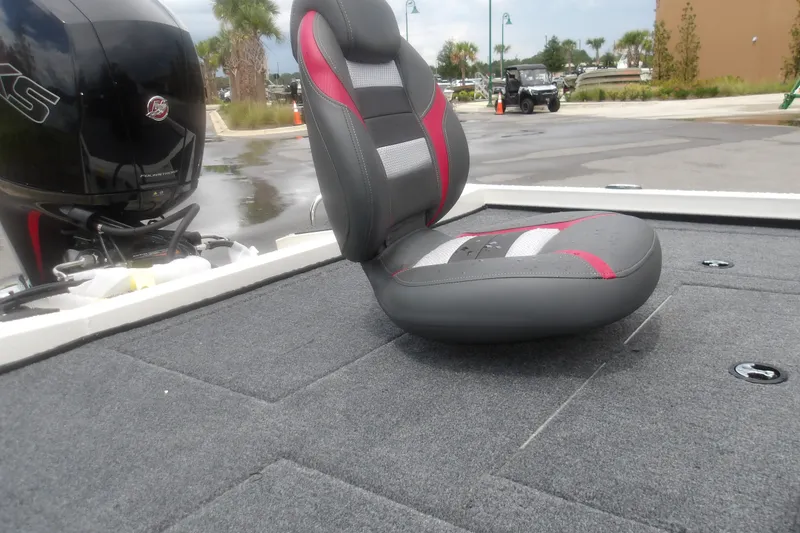 Slide: The Image of 2027 Ranger RT198P boat seat and motor on a carpeted deck. - 17