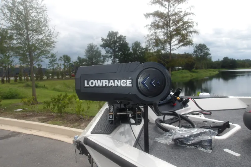Slide: The Image of Lowrance equipment on 2027 Ranger RT198P boat near a scenic lake. - 11