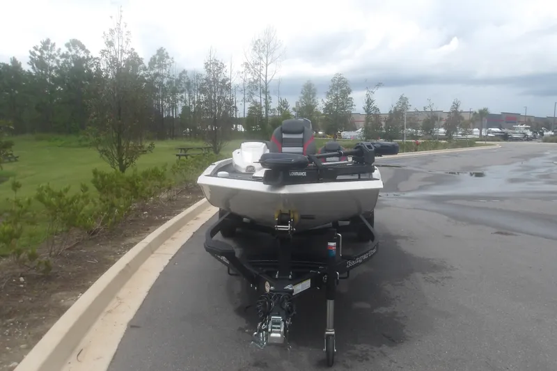 Slide: The Image of 2027 Ranger RT198P boat on trailer in parking lot, overcast sky. - 3