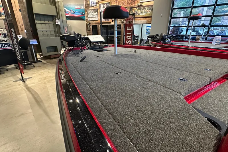 Slide: The Image of 2027 Nitro Z21 XL Pro boat interior with carpeted deck in showroom. - 6