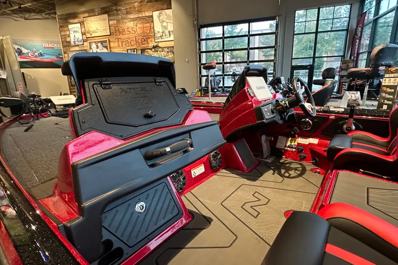 Slide: The Image of 2027 Nitro Z21 XL Pro boat interior with red accents and advanced dashboard controls. - 8
