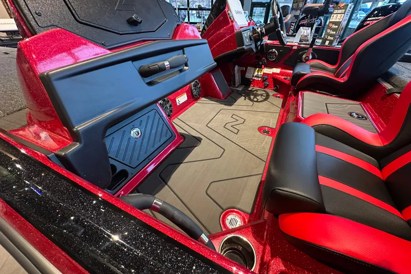 Slide: The Image of 2027 Nitro Z21 XL Pro boat interior with red and black seating, sleek dashboard, and modern design. - 14