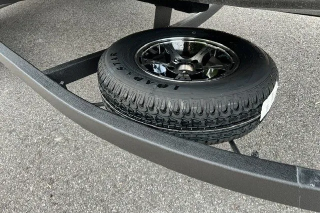 Slide: The Image of Spare tire mounted on Nitro ZV20 Pro 2027 trailer frame, parked on asphalt. - 12