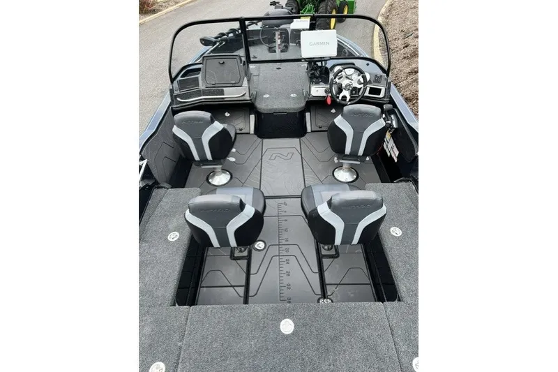 Slide: The Image of 2027 Nitro ZV20 Pro boat interior with four seats and steering console. - 4